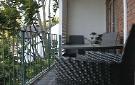The accommodation unit provides a balcony with a view of Stellenbosch's Herte Street